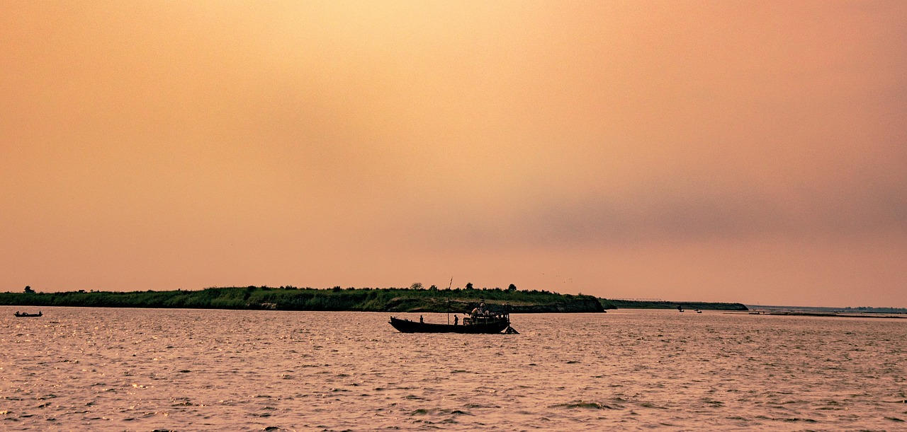 River and boat at sunset